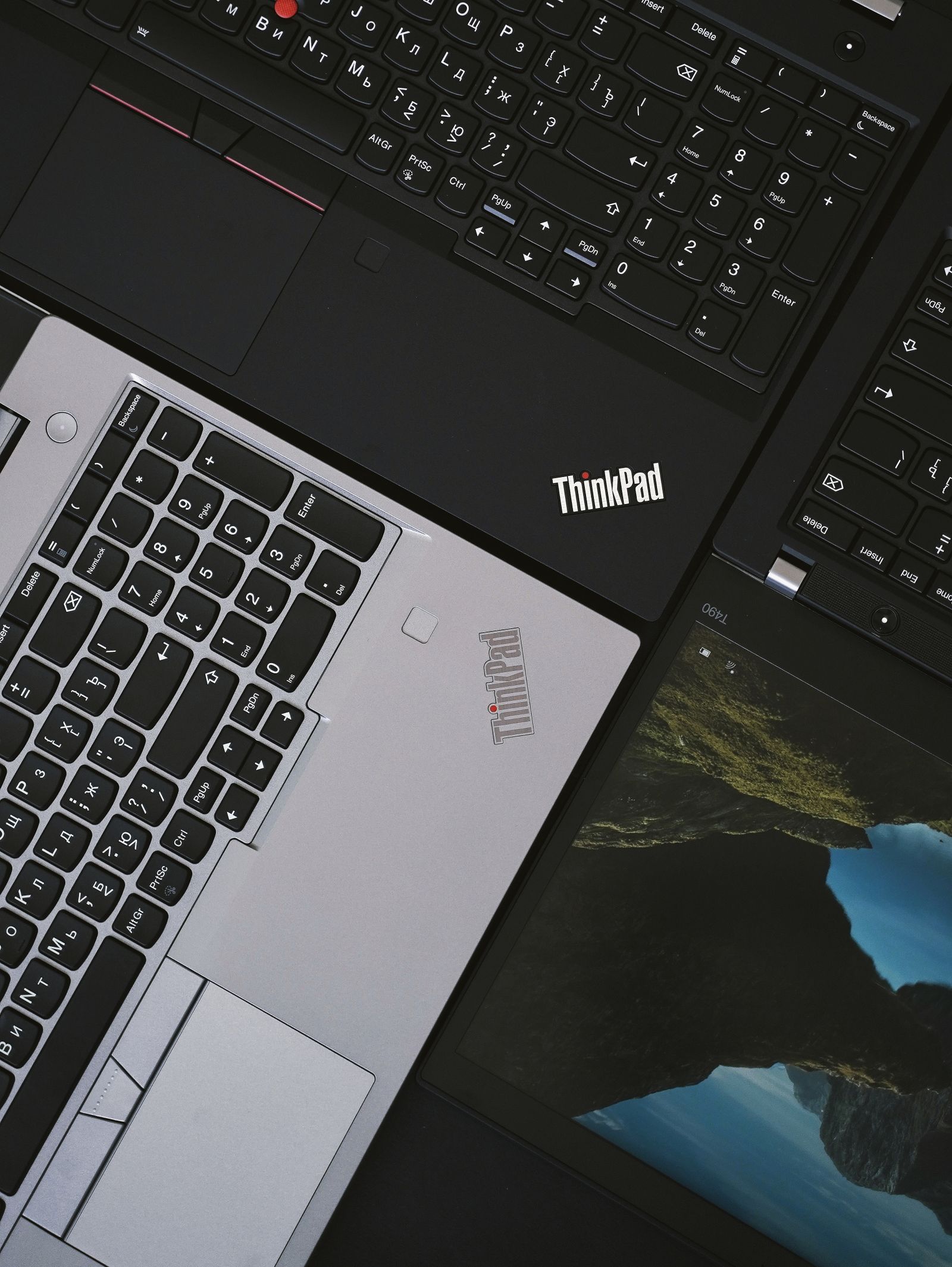 Close-up of a Lenovo ThinkPad laptop showing its red TrackPoint and ThinkPad logo